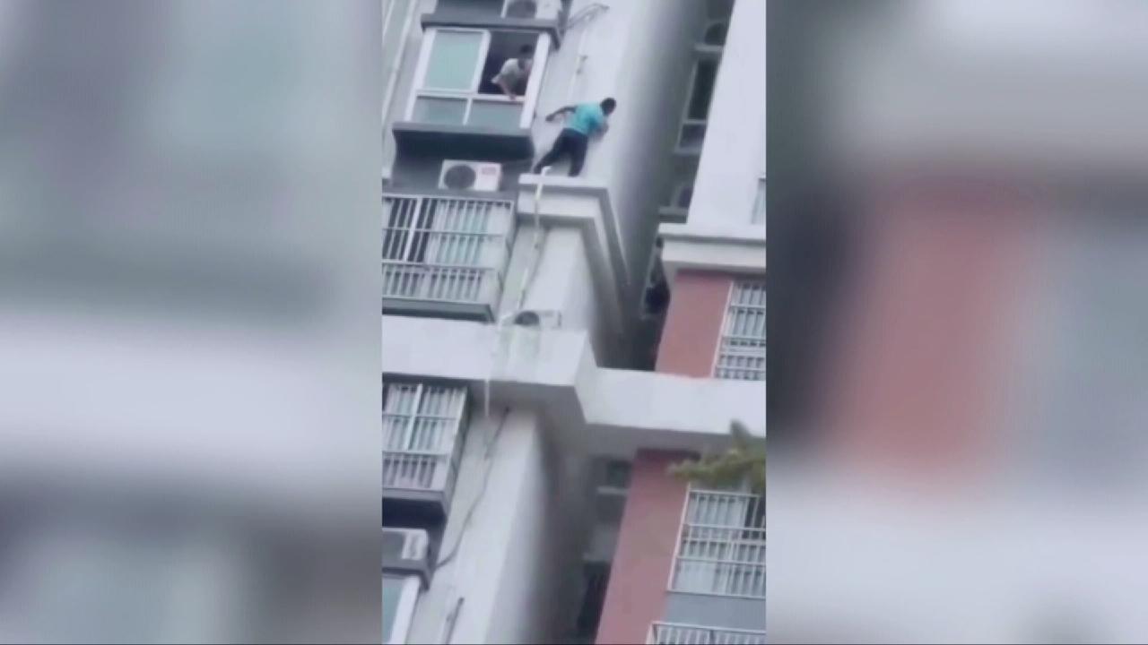 Chinese Men Rescue Girl Trapped On 15th-floor Building Ledge - Cgtn