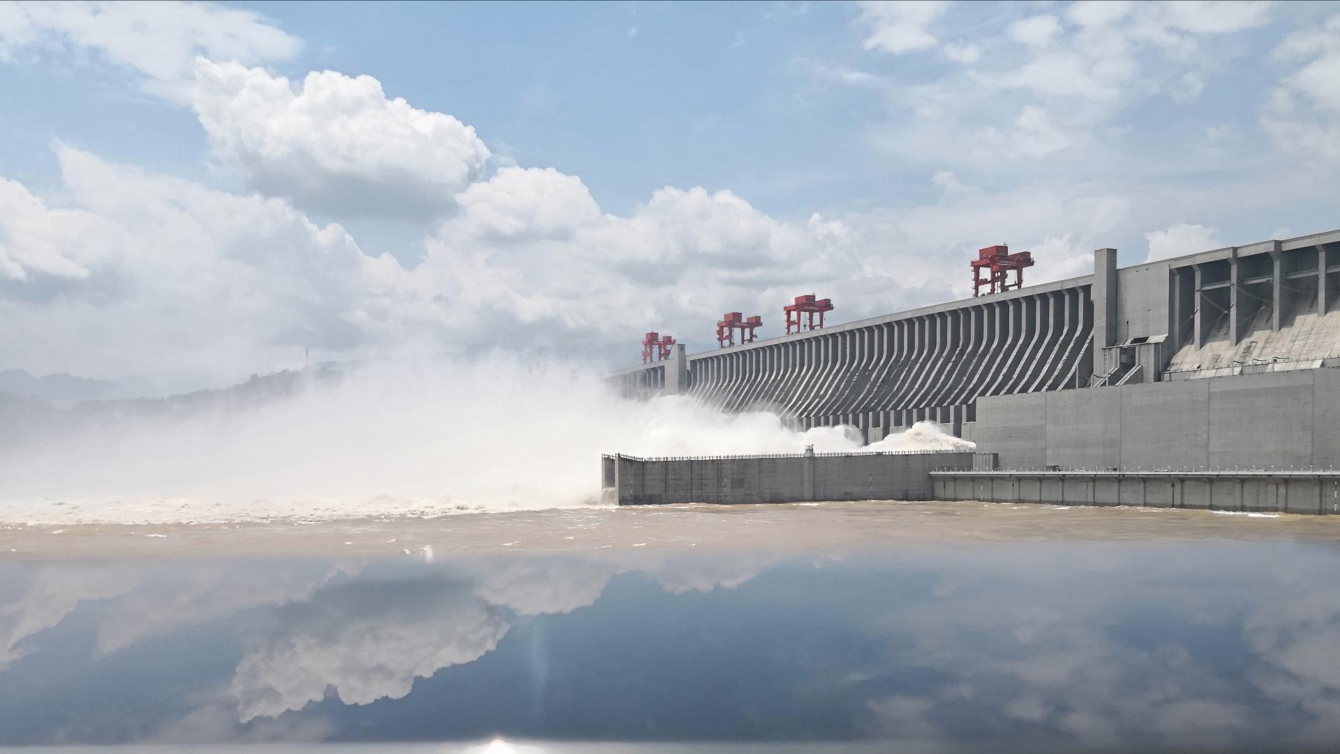 Floodwater gush out from the Jinxi Reservoir in Yongjia county