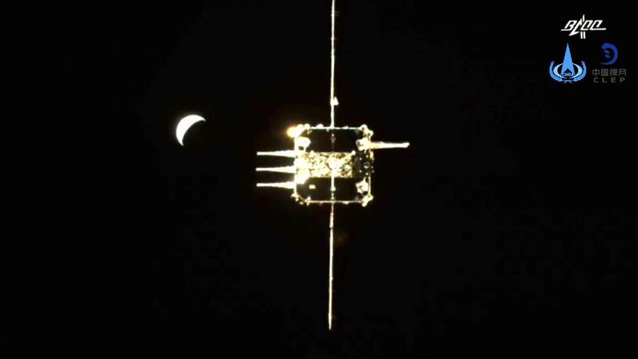 Photo of Doky stúpačky Chang’e-5 s orbitálnym modulom na mesačnej obežnej dráhe