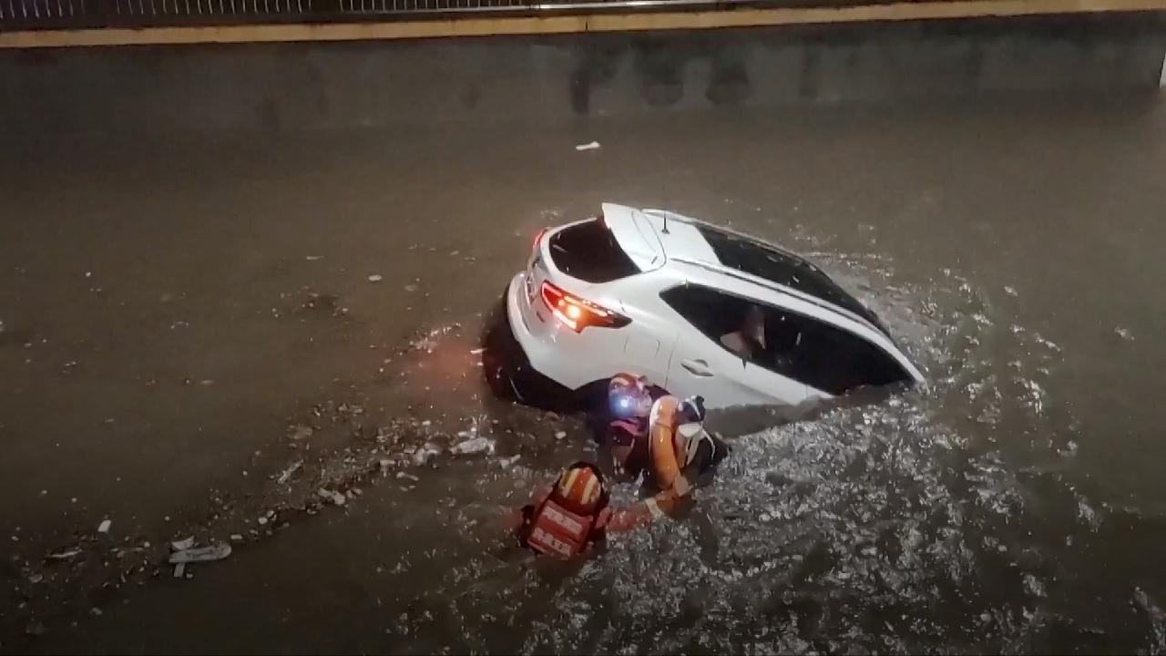 Rescuers rush to save residents, motorists as heavy rain hits China - CGTN