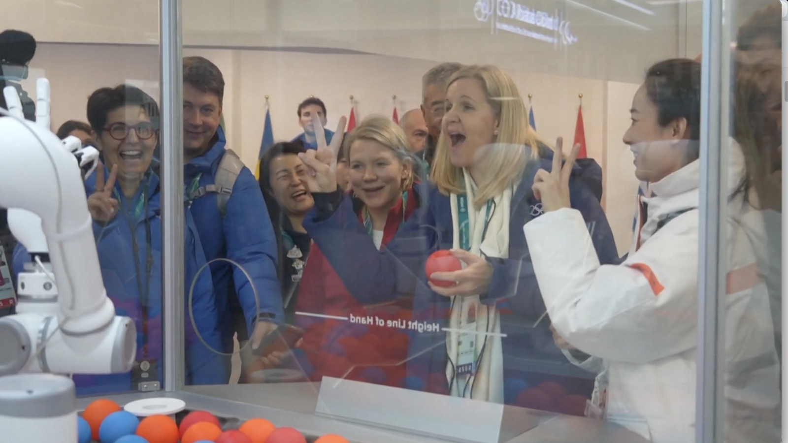 IOC president meets Chinese-developed robot during Milan visit