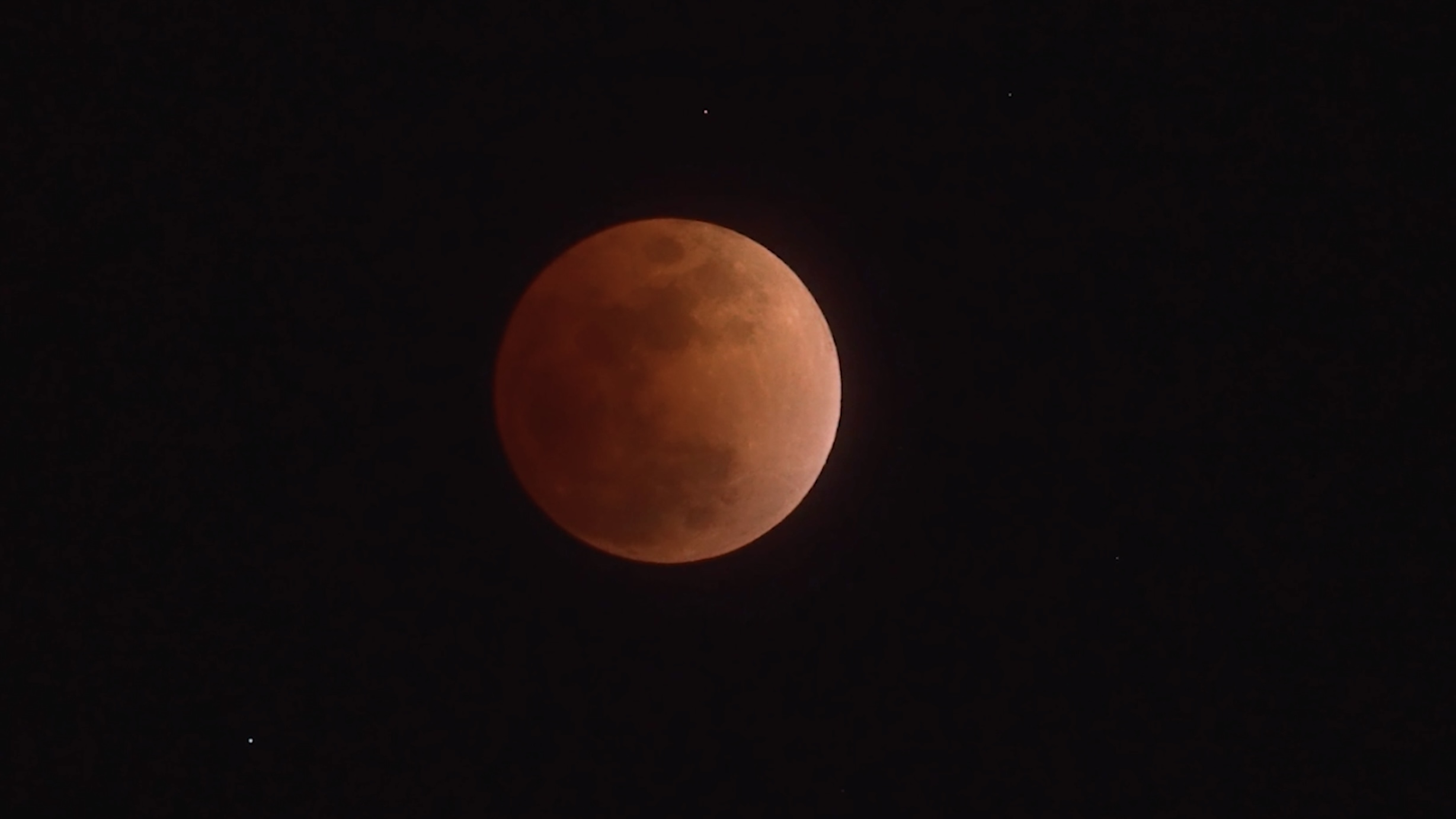Total lunar eclipse glows over Ulan Hada volcanoes on Lantern Festival