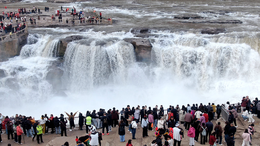 Where blossoms meet the roar at Hukou Waterfall