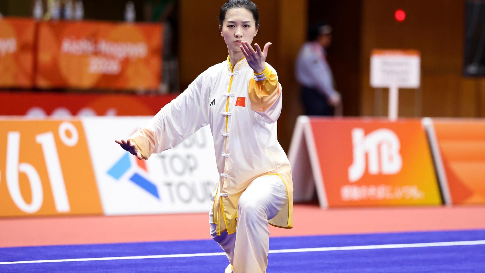 Tong Xin retains Asian Games Taijiquan and Taijijian titles
