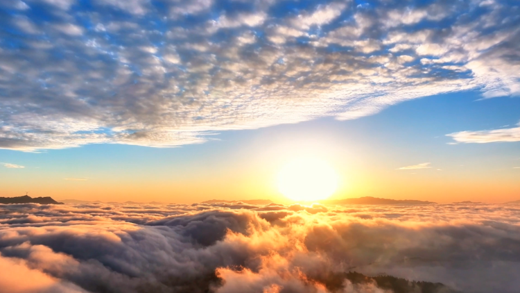Sunrise and fish-scale clouds blanket Guizhou's mountainous landscape