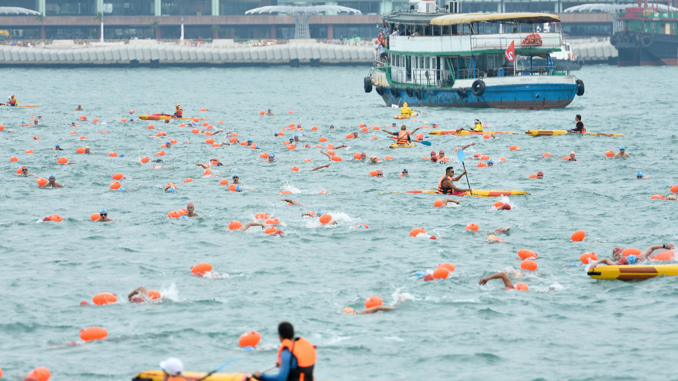Thousands of people swim across Hong Kong's renowned Victoria Harbour