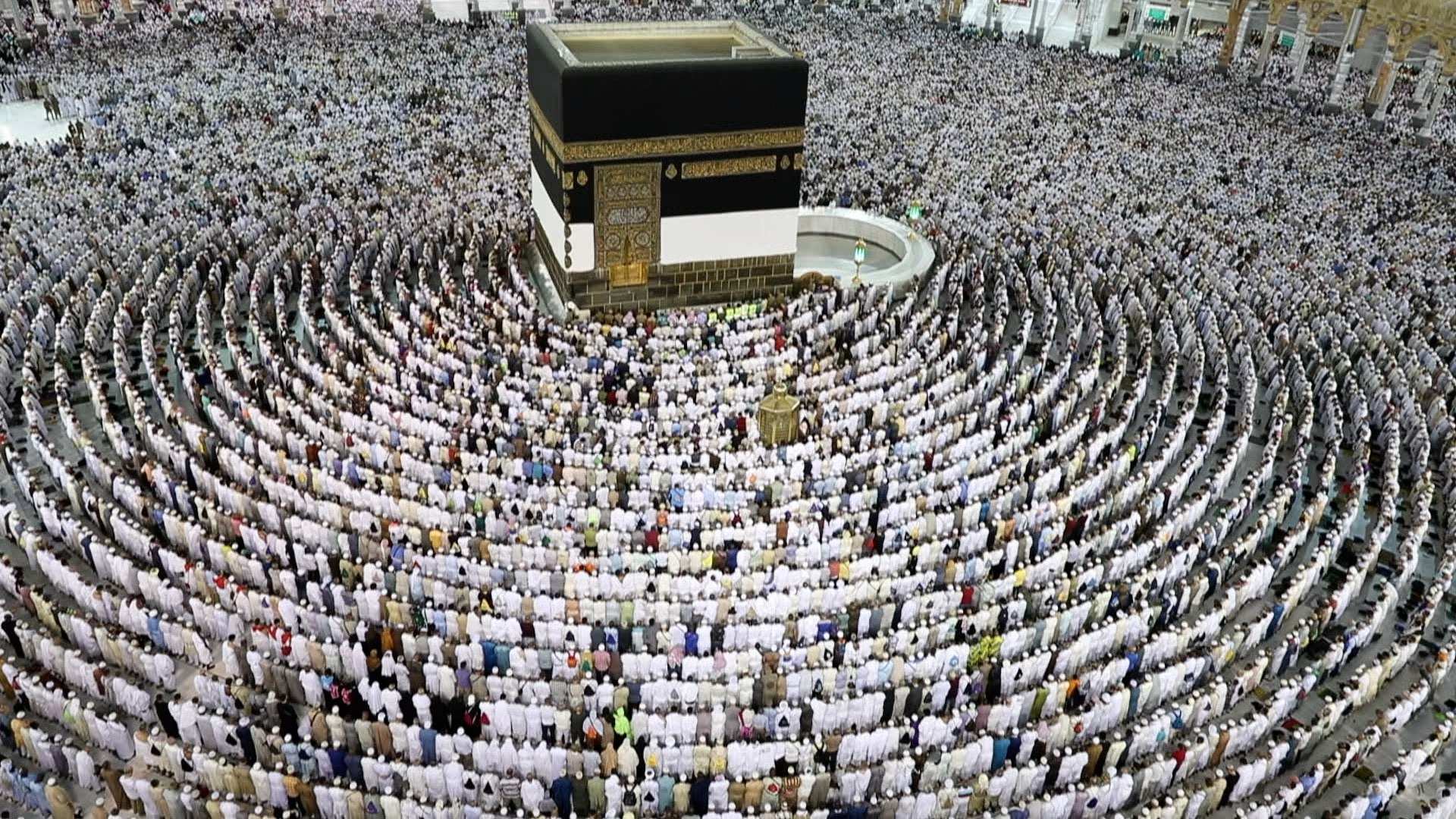 Muslim worshippers perform prayers around the Kaaba, Islam's holiest  shrine, at the Grand Mosque in Saudi Arabia's holy city of Mecca on August  15, prior to the start of the annual Hajj
