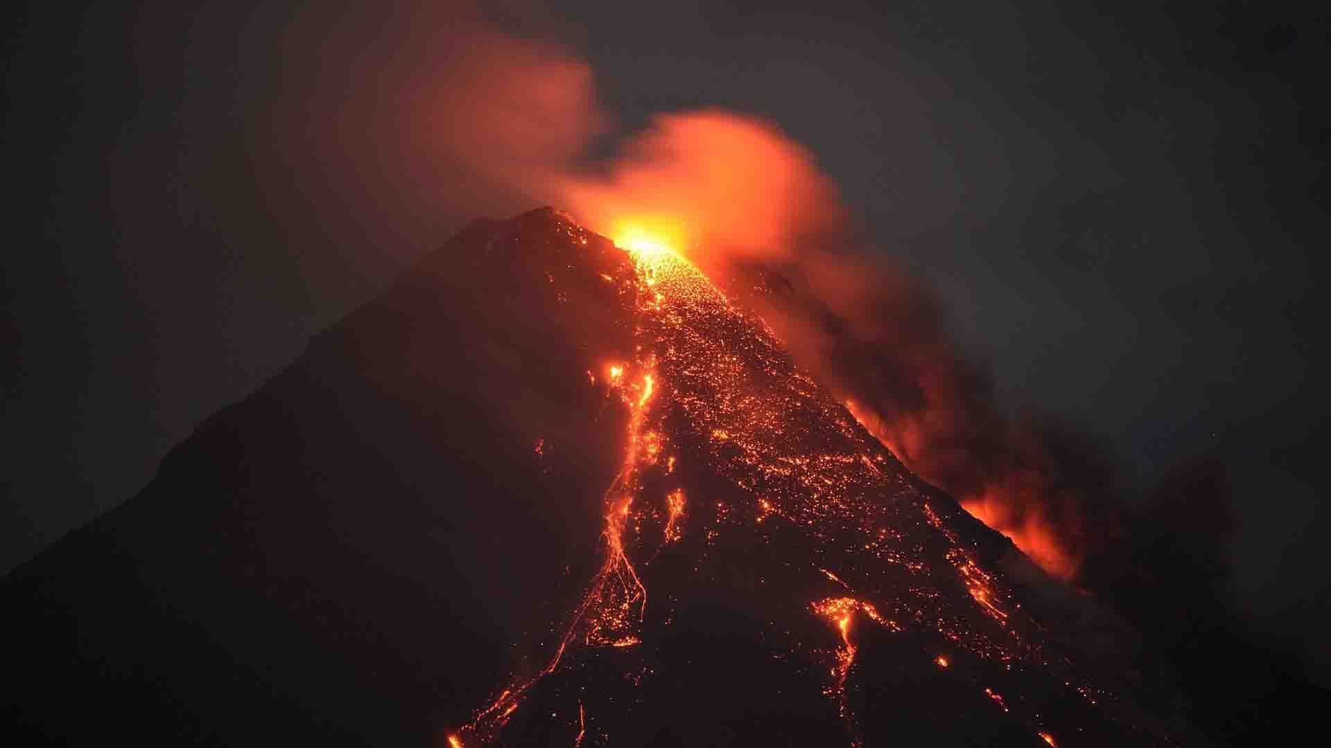 As blistering lava spews from the seething volcano nearby, Philippine ...